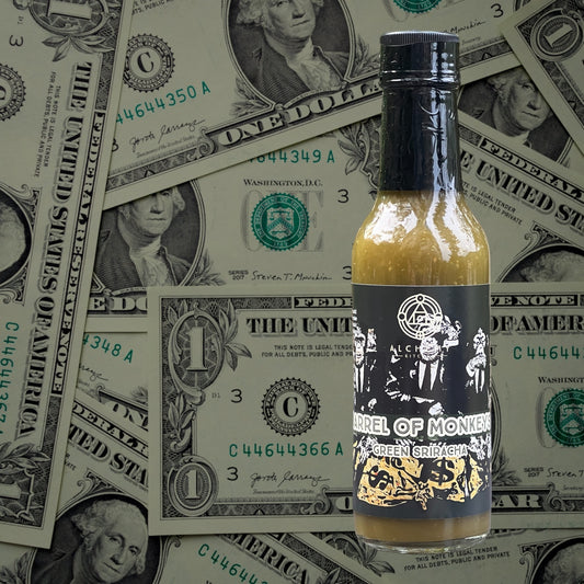 bottle of alchemy kitchen barrel of monkeys with banknotes in the background