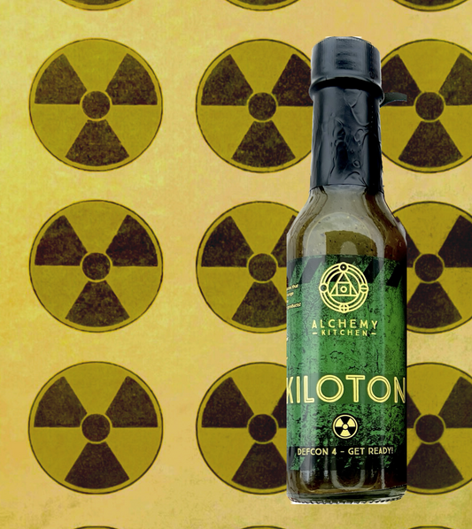 Bottle of Kiloton hot sauce with nuclear background
