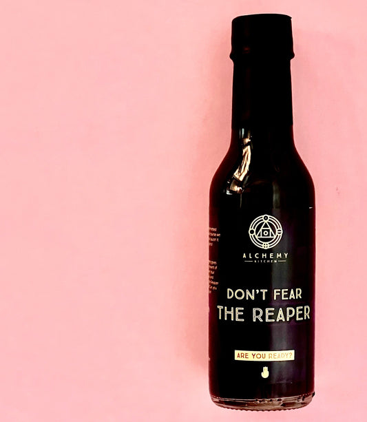 A bottle of Alchemy Kitchen Don't Fear the Reaper dessert hot sauce